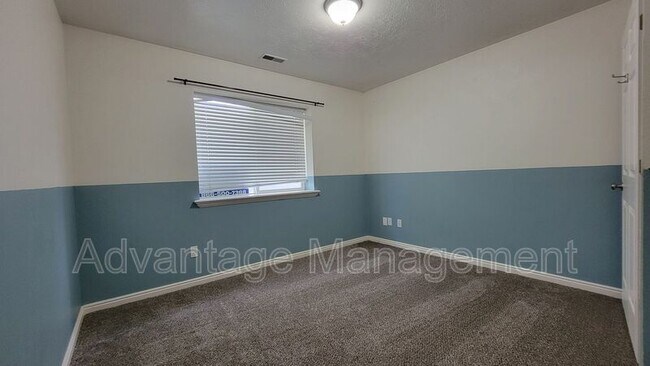 Building Photo - 8083 N Ridge Loop E