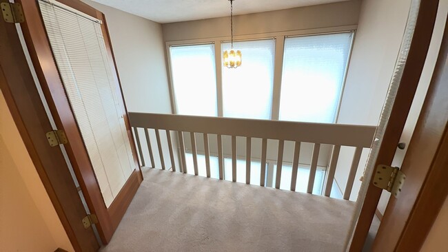 Building Photo - 4bd/3ba HUGE Home w/Hardwood Floors, Russian Fireplace, 2-Car Garage & Fenced Back Yard!