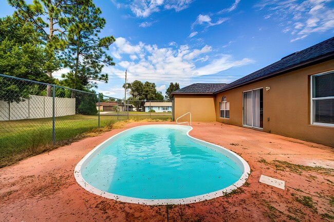 Building Photo - 4-bedroom, 2-bathroom POOL home