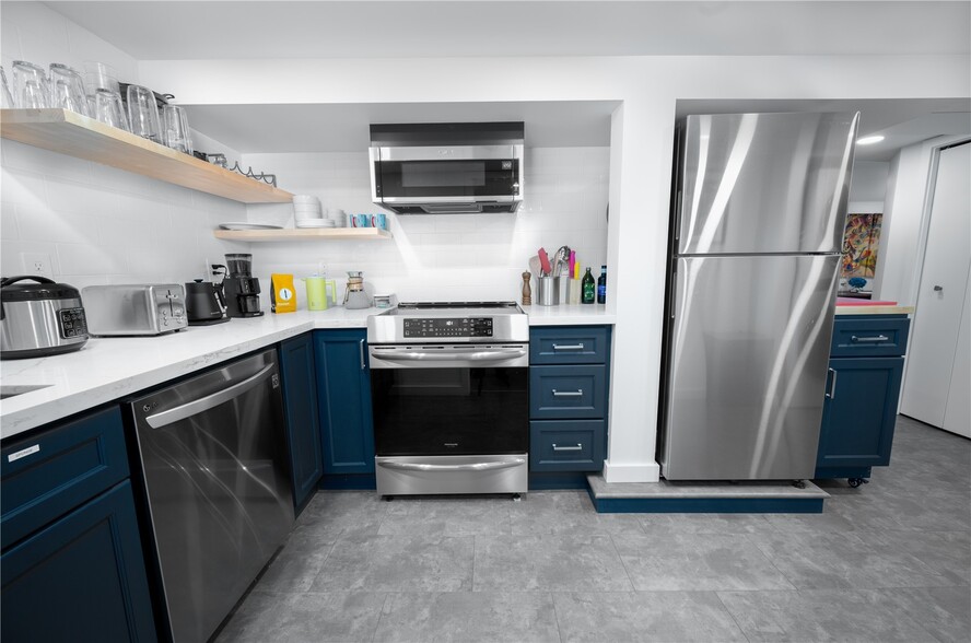 Kitchen with induction stove and convection oven. - 1514 NW 70th St