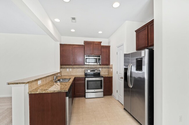 Building Photo - Spacious 4-Bedroom End-Unit Townhome in a ...