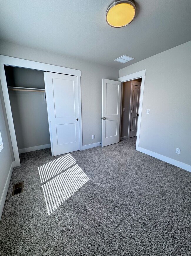 Building Photo - Sage Meadows II Townhomes — Lakeside Living Meets Modern Comfort!