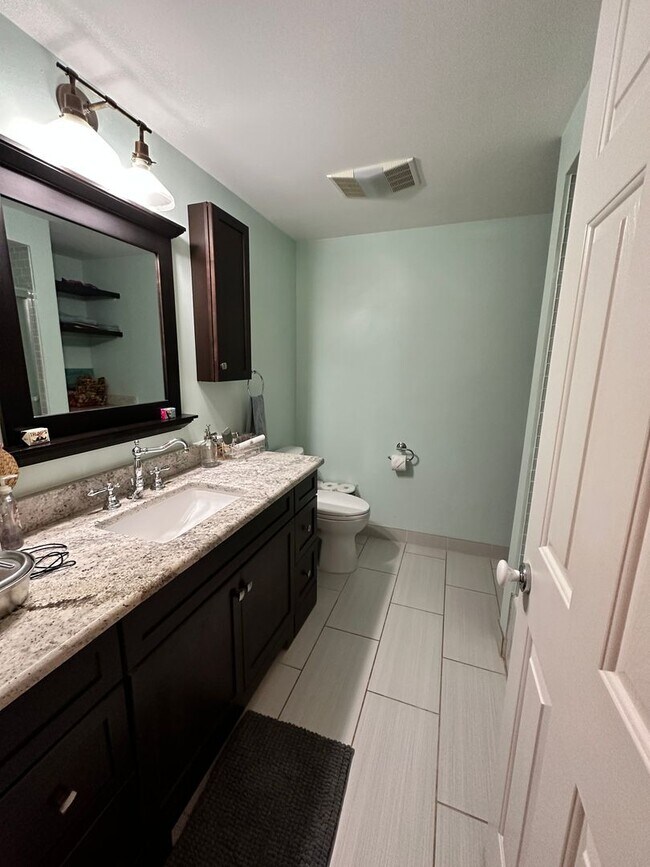 Building Photo - Dream Home in Highland, Michigan: Your Private Oasis on 5 Wooded Acres