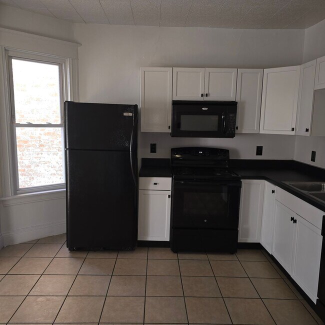 Building Photo - Large remodeled 4 bedroom with off street parking available