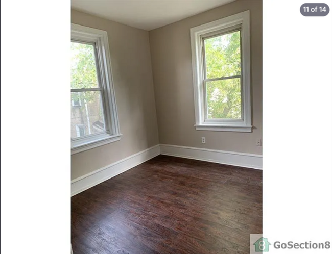 Building Photo - Spacious 3BR Townhouse with Modern Kitchen  Hardwood Floors  Available Now!