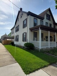 Building Photo - Pet friendly duplex w brand new kitchen & first floor LVP, basement, fenced yard, deck, near comm...