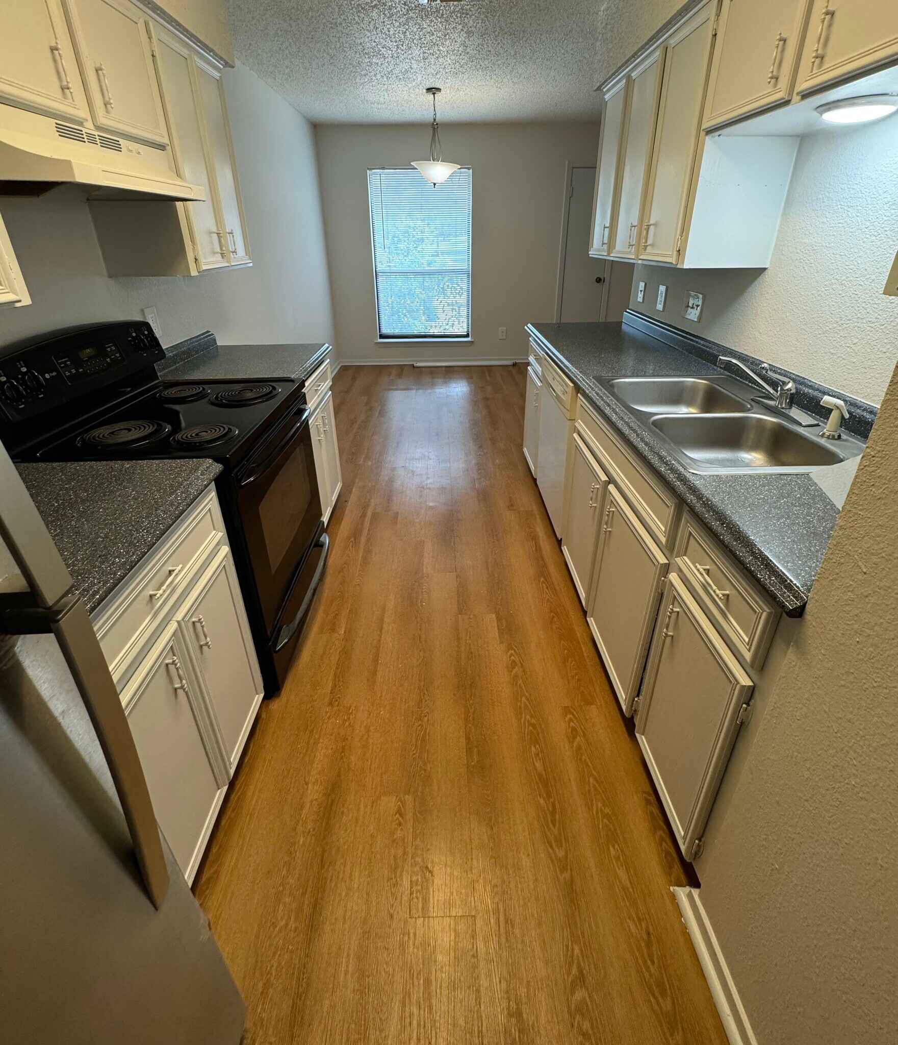 View from end of kitchen towards dining area - 7000 Oak Meadow Cir