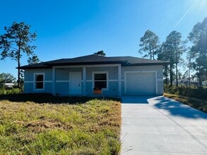 Building Photo - ONE OF A KIND! BRAND NEW 1 Bedroom-1 Bath- 1 Car Garage in Desirable Lehigh Acres!