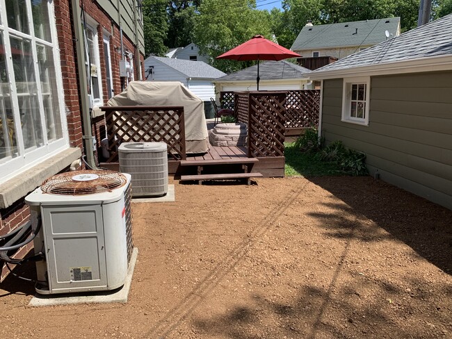 Rear entrance with deck and private patio area. Grill and sandbox not included. - 4242 N Olsen Ave