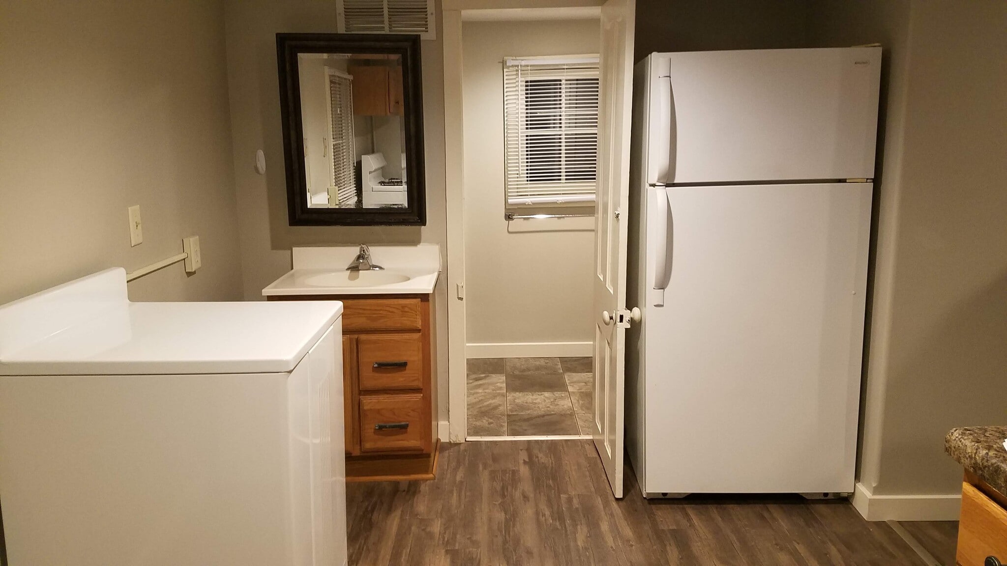 Kitchen, looking into bathroom - 103 12th W St