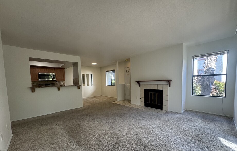 Kitchen, dining room, front door, fireplace, living room - 9408 Twin Trails Dr