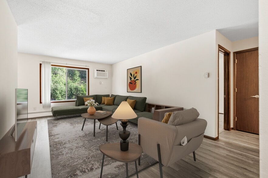 Step into the inviting comfort of Como Park Apartments. Featuring spacious living areas, modern design, and abundant natural light, this home is perfect for relaxation and social gatherings. Don't miss your chance—schedule a tour today! - Como Park Apartments
