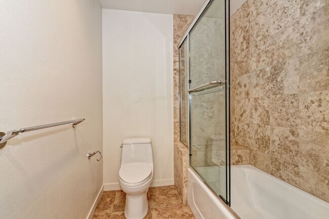 Building Photo - Modern Downtown Condo in Premier High-Rise...