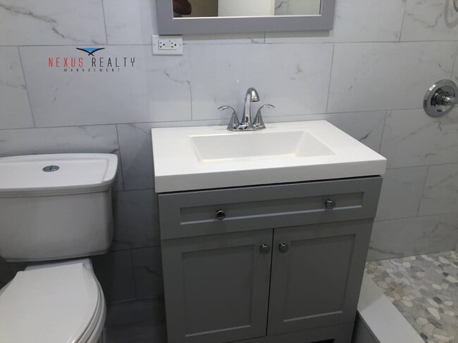 Building Photo - 225-01 59th Ave