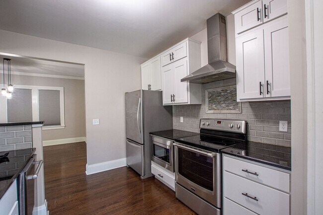 Building Photo - Adorable Brick 4 Bedroom Ranch with Finish...