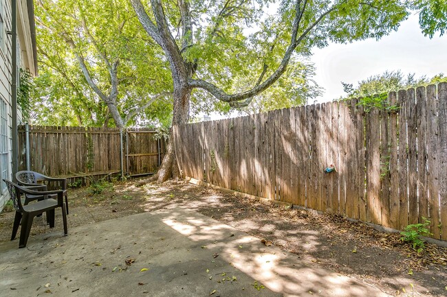 Private enclosed patio. Nice amount of shade & seating for two. - 4901 Bryce Ave