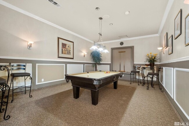 Building Photo - Discover Your Dream Condo with Stunning Mountain Views a 1 Car Garage & Covered carport in NW Ren...