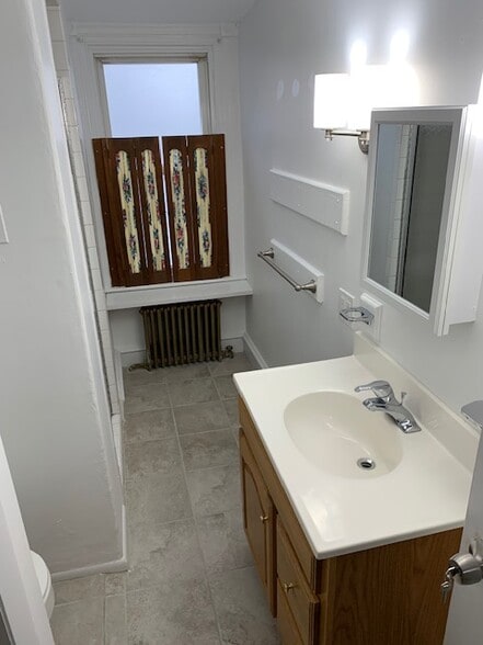 Bathroom 2; Shutters can be taken down or replaced. - 832 Cricket Ave
