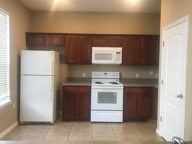 Building Photo - MOVE IN SPECIAL- Beautiful 3/2.5 Harmony Condo.