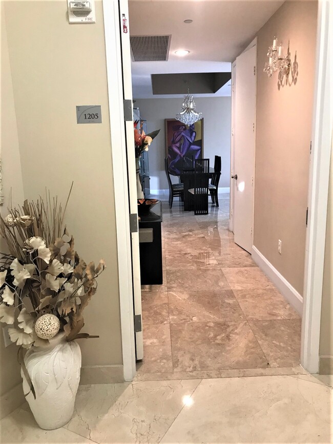 Entry to the condo from private foyer - 15901 Collins Ave