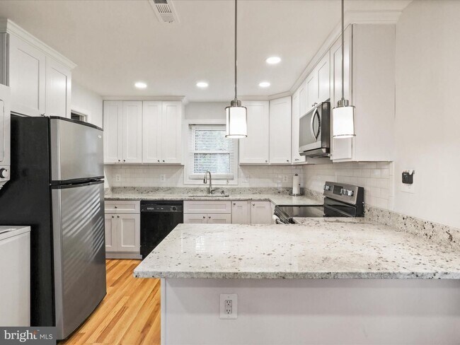 Building Photo - This home blends urban accessibility with peaceful natural surroundings.