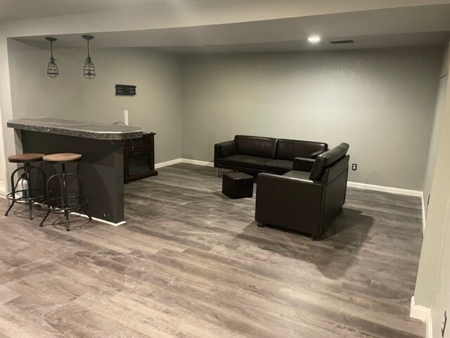 Downstairs living area and bar (stools and couch included) - 3425 Tejon St