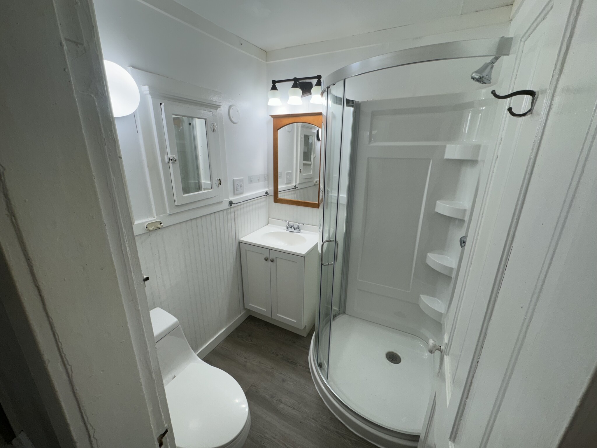 Newly remodeled bathroom (new shower, vanity, and flooring) - 164 13th Ave NE