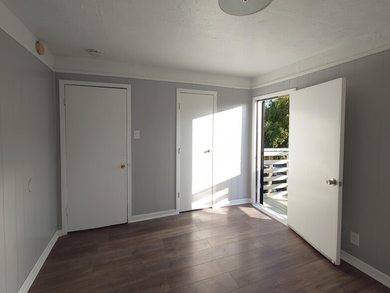 master bedroom with balcony door and closet - 1474 7th St