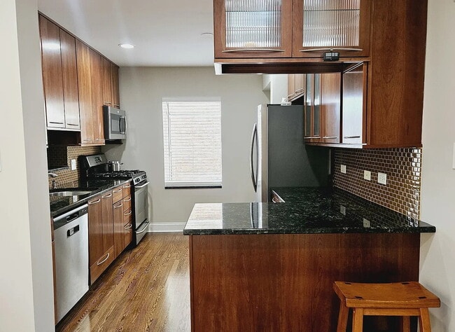 Building Photo - Upscale Living at Its Finest