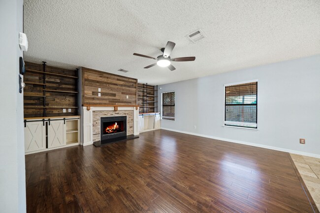 Building Photo - Sign your lease and receive a FREE 50" TV!!!  "Spacious 4-Bedroom Retreat with Fireplace in Charm...
