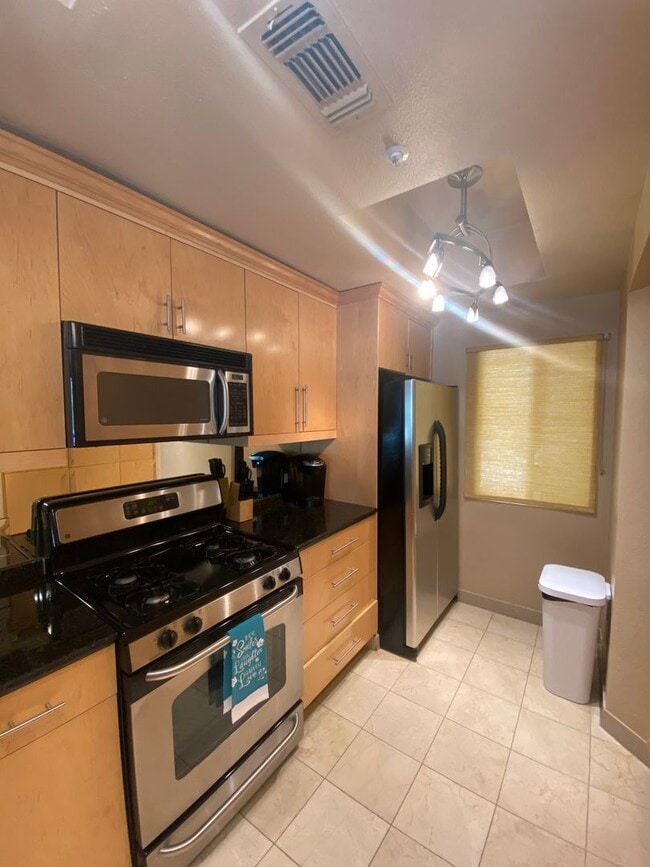 Building Photo - Fully furnished 2 bedroom unit in 24/7 guard gated community