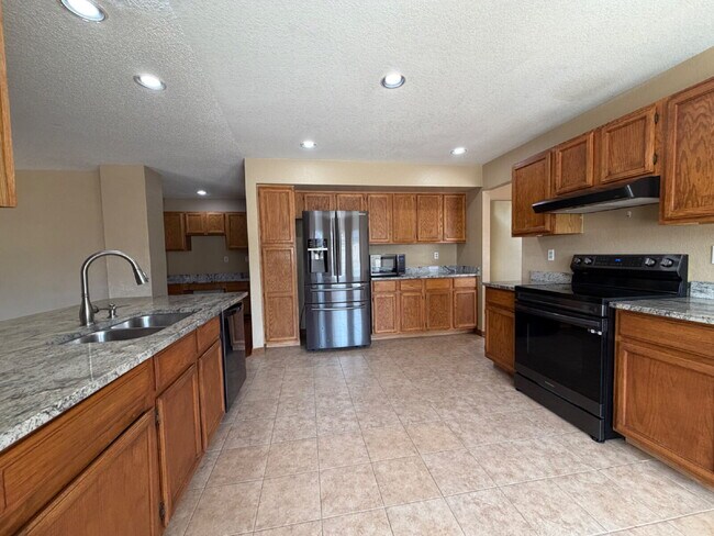 Building Photo - ~Available Now~  Beautiful Four Bedroom Home with Fireplace, Private Yard & Luxurious Primary Suite!