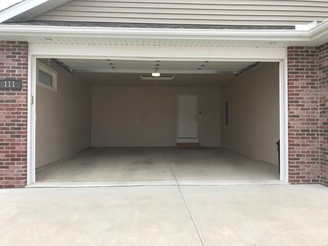 Large 2 stall garage, insulated with garage opener. - 113 Scenic Dr