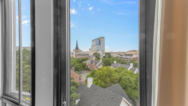 Building Photo - Industrial-Themed Mid-Rise, One-Level Cond...