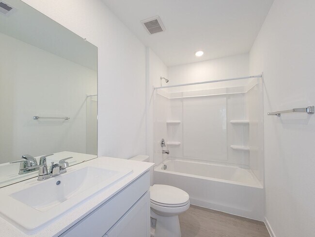 Building Photo - This single-story home shares an open layout between the kitchen, nook and family room for easy e...