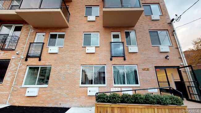 Building Photo - 67-09 Austin St