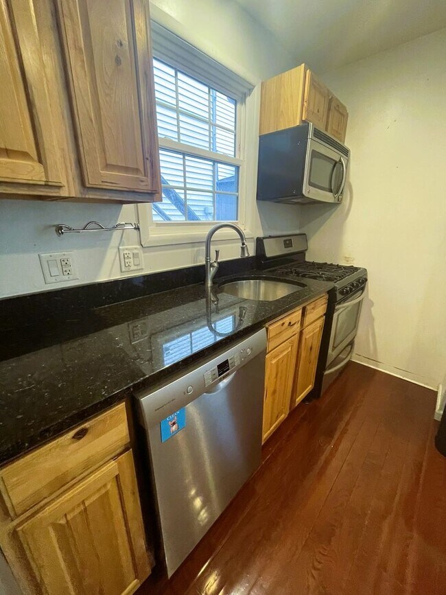 Building Photo - One Block to the Diag! Charming Home with Private Courtyard + Parking