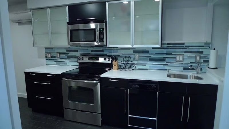 Full size Kitchen supplied with utensils, pots / pans, plateware, dishwasher & disposal. - 2300 Ontario Rd NW