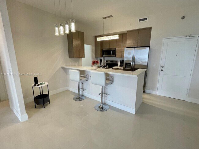 Building Photo - 10185 Collins Ave