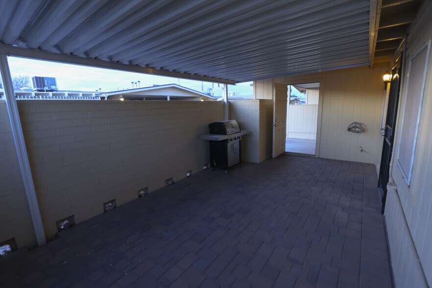 Covered and paved back patio - 10941 W Santa Fe Dr