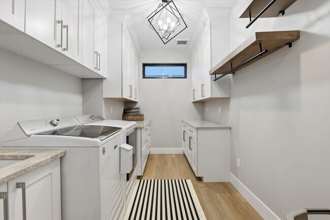 Building Photo - Modern 5-Bed Home in Atlas Waterfront — Elevator, Luxury Finishes & Prime Location