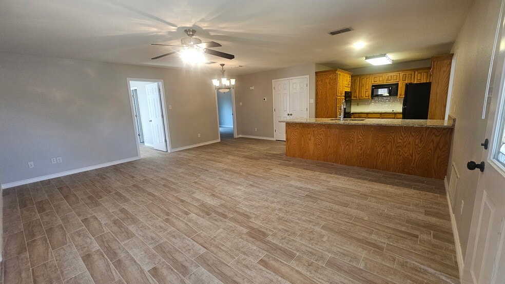 Looking across living room to Kitchen - 203 Bluebonnet St