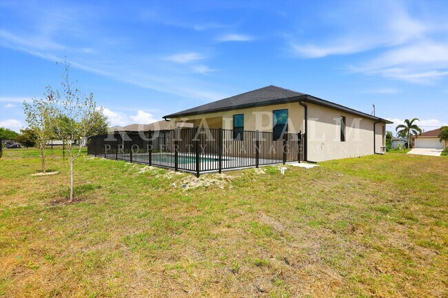 Building Photo - 3BR/2BA New Construction with Pool, Fence & Garage — Built Yesterday, Ready Today - Cape Coral