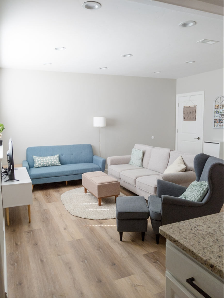 Basement family room, featuring a large window. - 14487 S Cuchara Way
