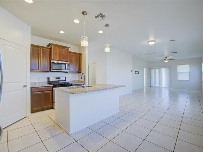 Building Photo - Bright & Spacious 3-Bedroom Home with Open-Concept Living and Community Pool