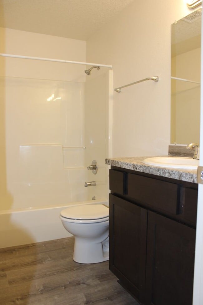 Building Photo - 4 BR, 2 1/2 BA home with fenced yard.