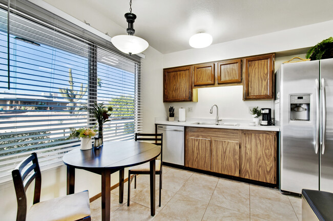 Enjoy morning coffee and views at your eat-in kitchen table. - 12414 W Nugget Ct