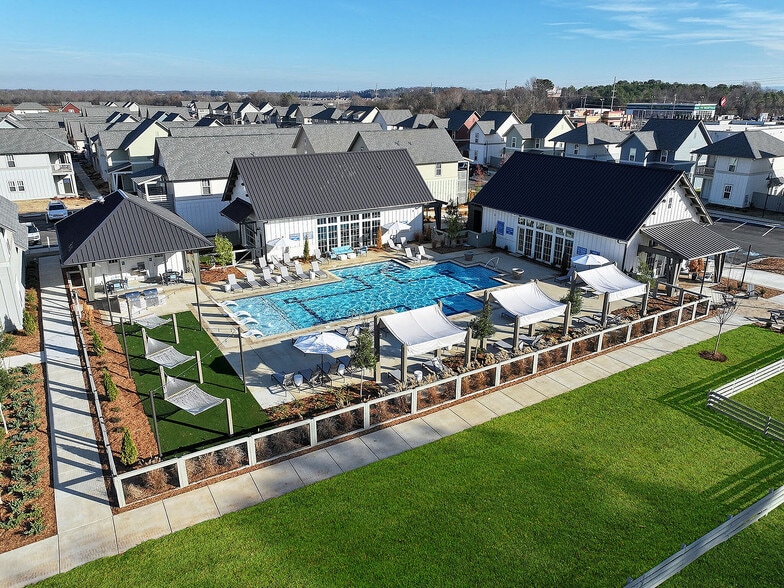 Aerial view of pool and club house - LEO at Carmel - SINGLE FAMILY RENTAL HOMES