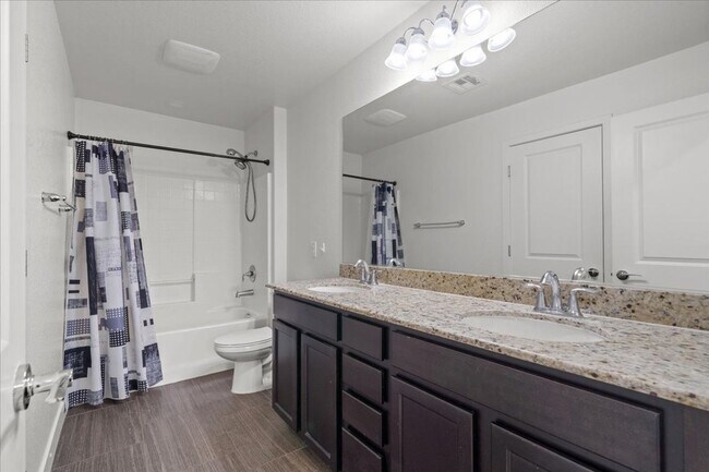 Building Photo - Modern Gated 3 Bedroom Retreat with Loft & Entertainer’s Backyard