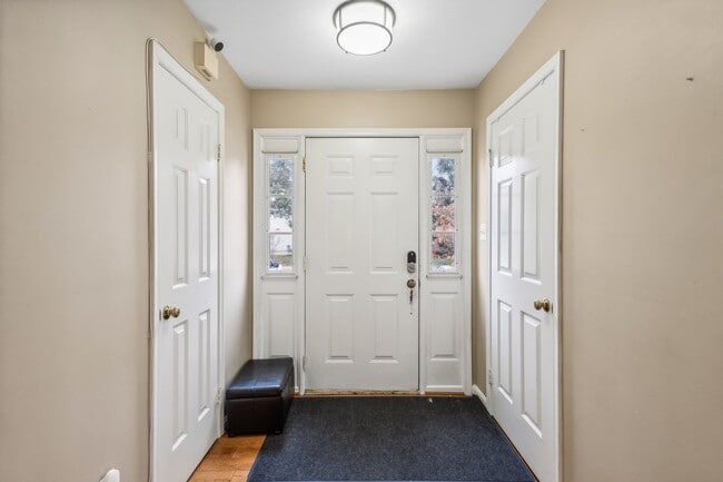 Building Photo - Modern Brick End-Unit Townhome with Stunning Upgrades and Serene Wooded Views